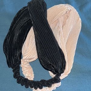 2 headbands; nude blush and black. Elastic on the bottom end of both